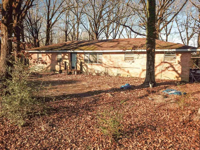a view of a backyard of the house