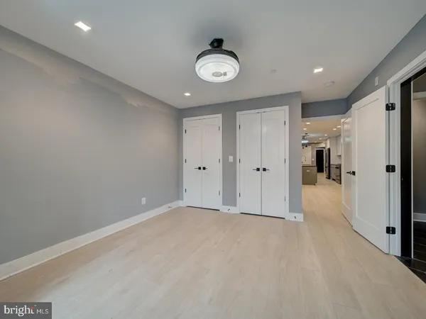 a bathroom with double sink and a mirror