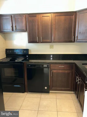 a kitchen with a stove and a cabinets
