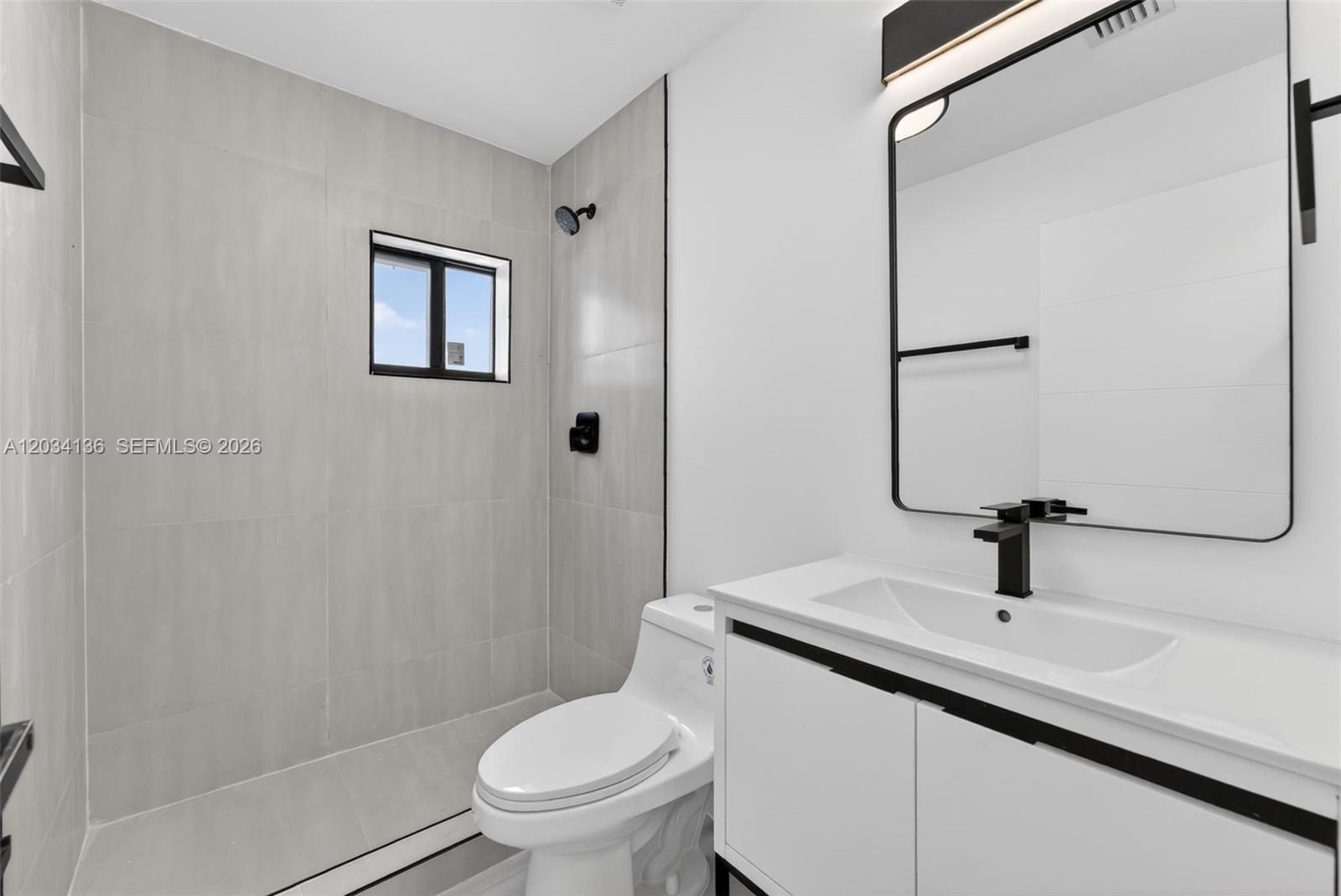 10315 Southwest 176th Street Miami, FL 33157 - Photo 11 of 18 a bathroom with a sink toilet and shower