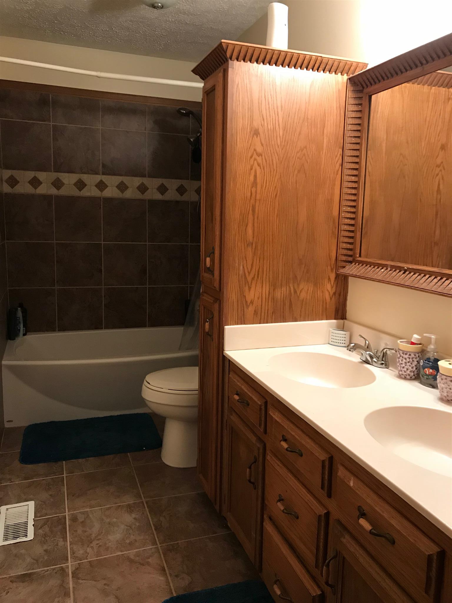 571 Grindstone Hollow Road Dickson, TN 37055 - Photo 16 of 23 Hall Bath between 2 large bedrooms on the other side of the house