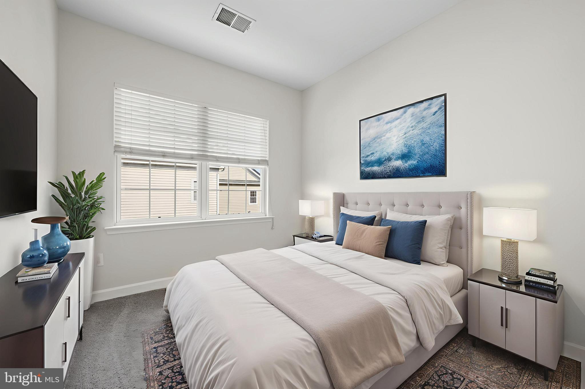 5564 Lanier Avenue Suitland, MD 20746 - Photo 6 of 37 a bedroom with bed and window