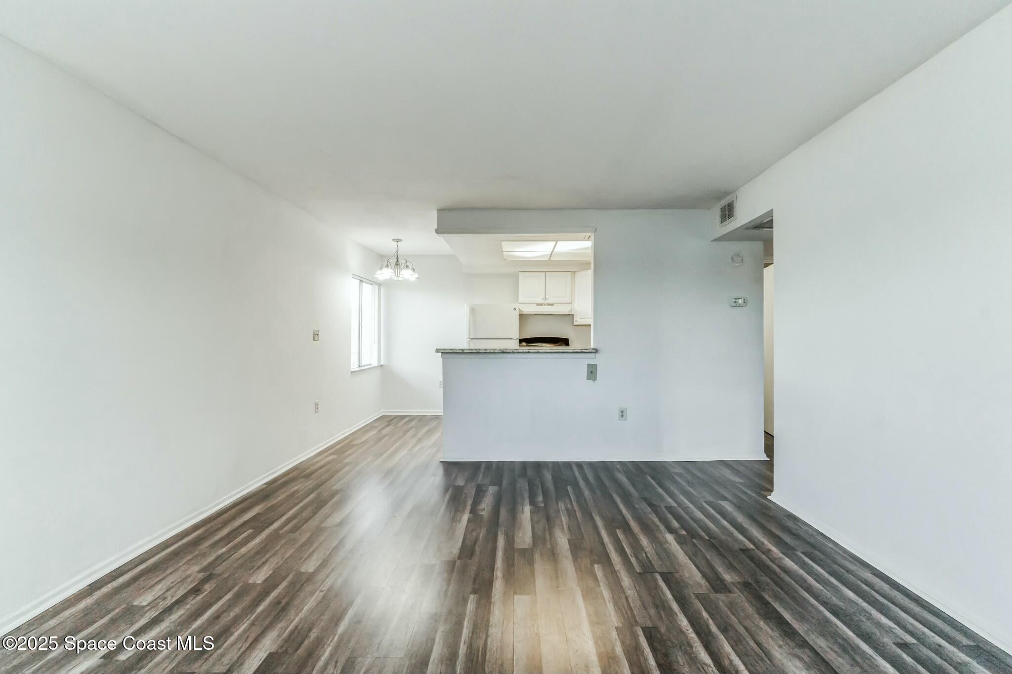 800 North Fiske Boulevard, Unit 513 Cocoa, FL 32922 - Photo 19 of 21 a view of a kitchen with wooden floor
