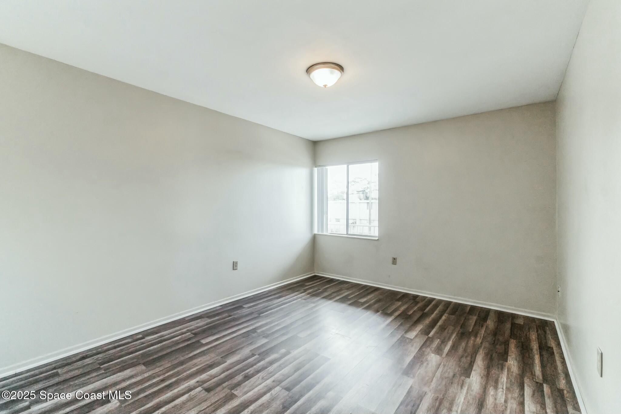 800 North Fiske Boulevard, Unit 513 Cocoa, FL 32922 - Photo 20 of 21 a view of empty room with wooden floor and fan