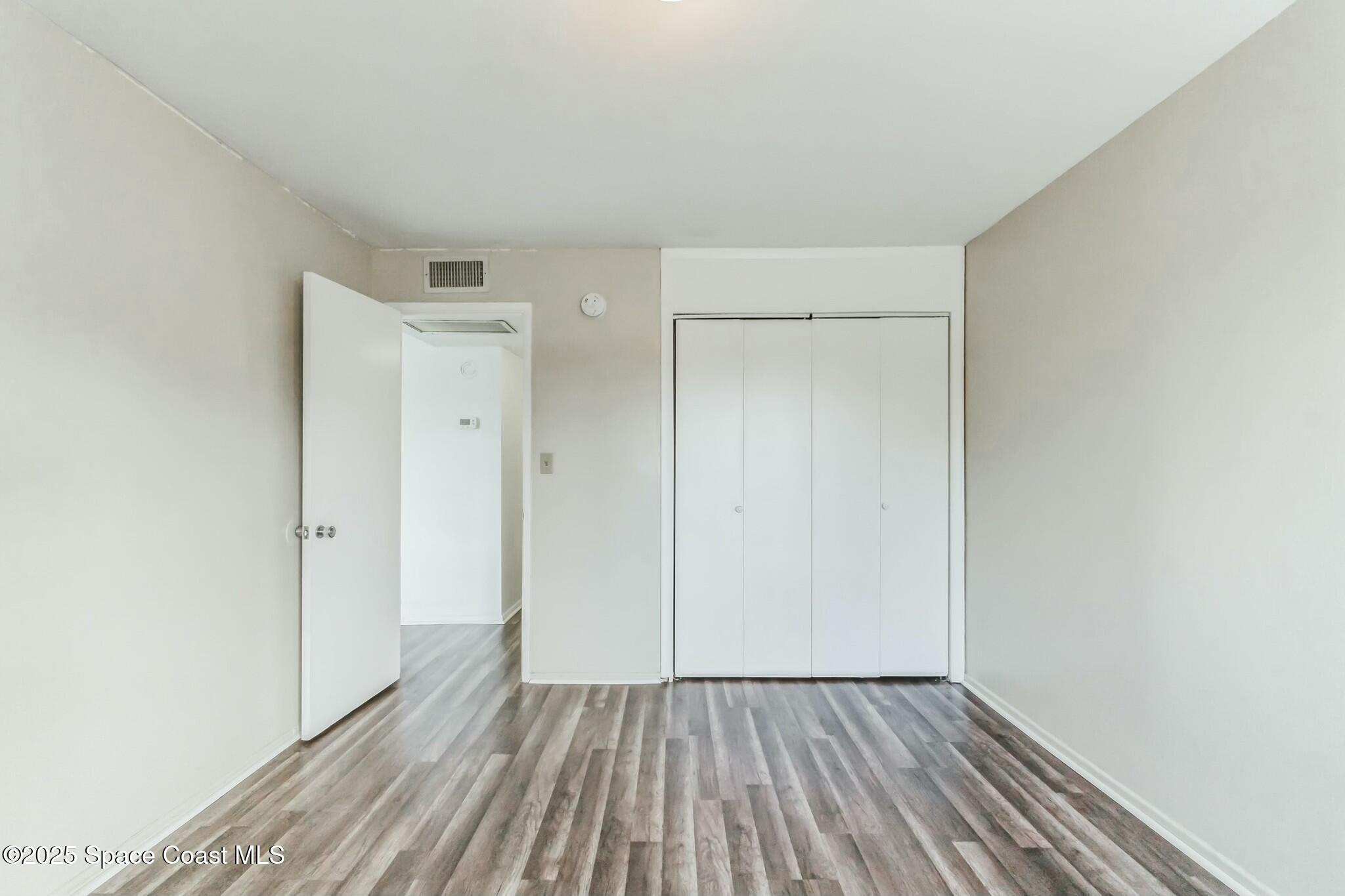 800 North Fiske Boulevard, Unit 513 Cocoa, FL 32922 - Photo 8 of 21 a view of wooden floor in an empty room