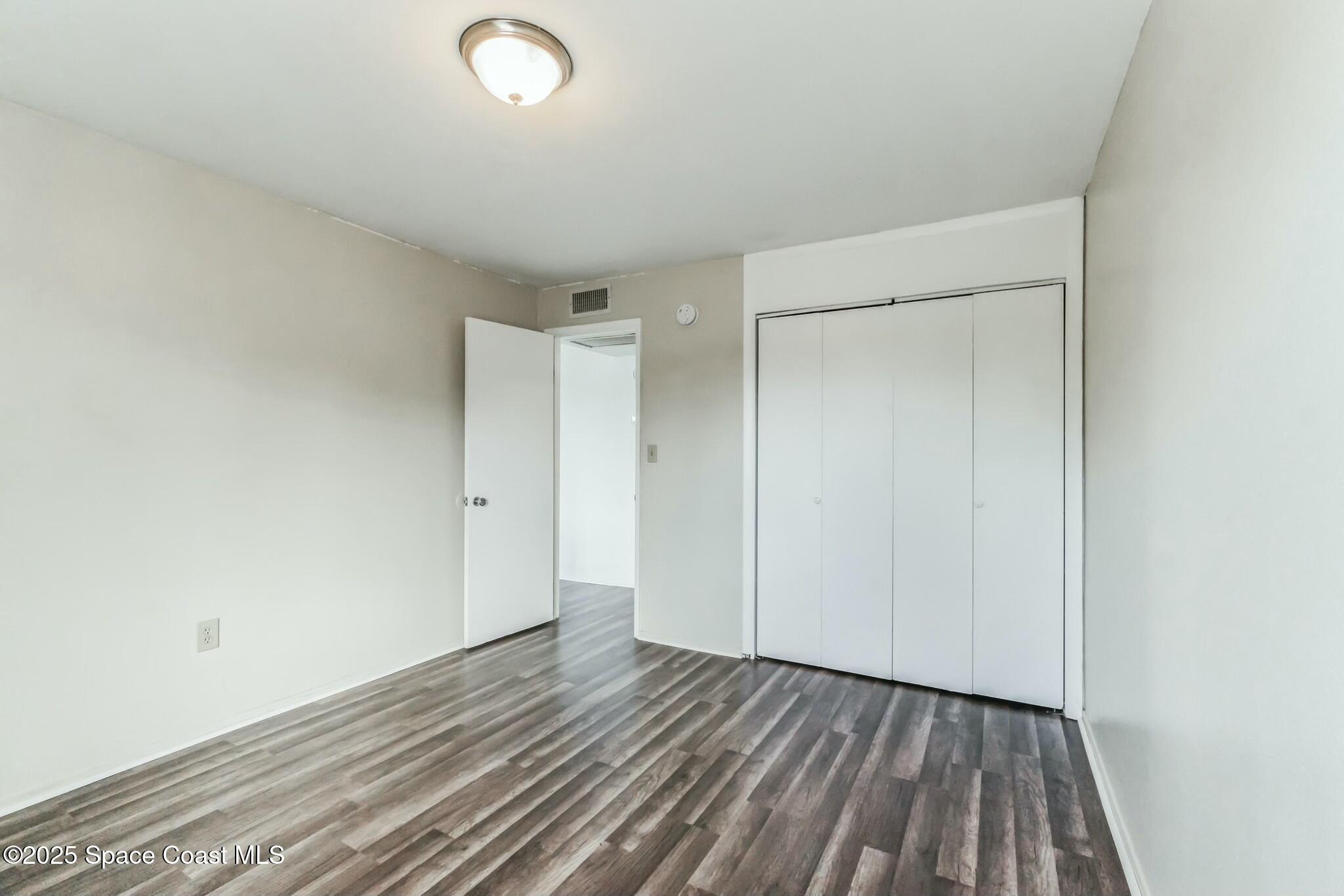 800 North Fiske Boulevard, Unit 513 Cocoa, FL 32922 - Photo 9 of 21 a view of room with wooden floor