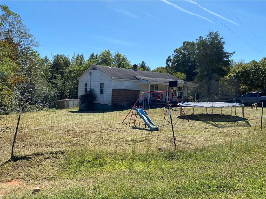 5644 Allison Road Pelham, NC 27311 - Photo 9 of 12 Side Yard view