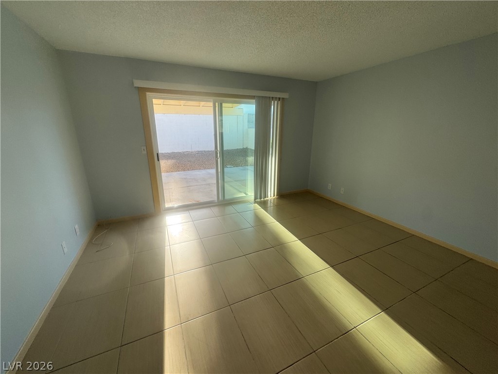 4420 Del Monte Avenue, Unit RENTAL Las Vegas, NV 89102 - Photo 6 of 20 Sliding doors provide seamless indoor-outdoor living from this versatile room.