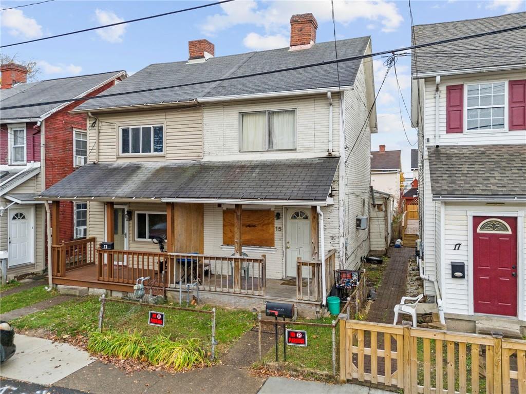 15 Orchard Street McKees Rocks, PA 15136 - Photo 6 of 6 a front view of a house with garden