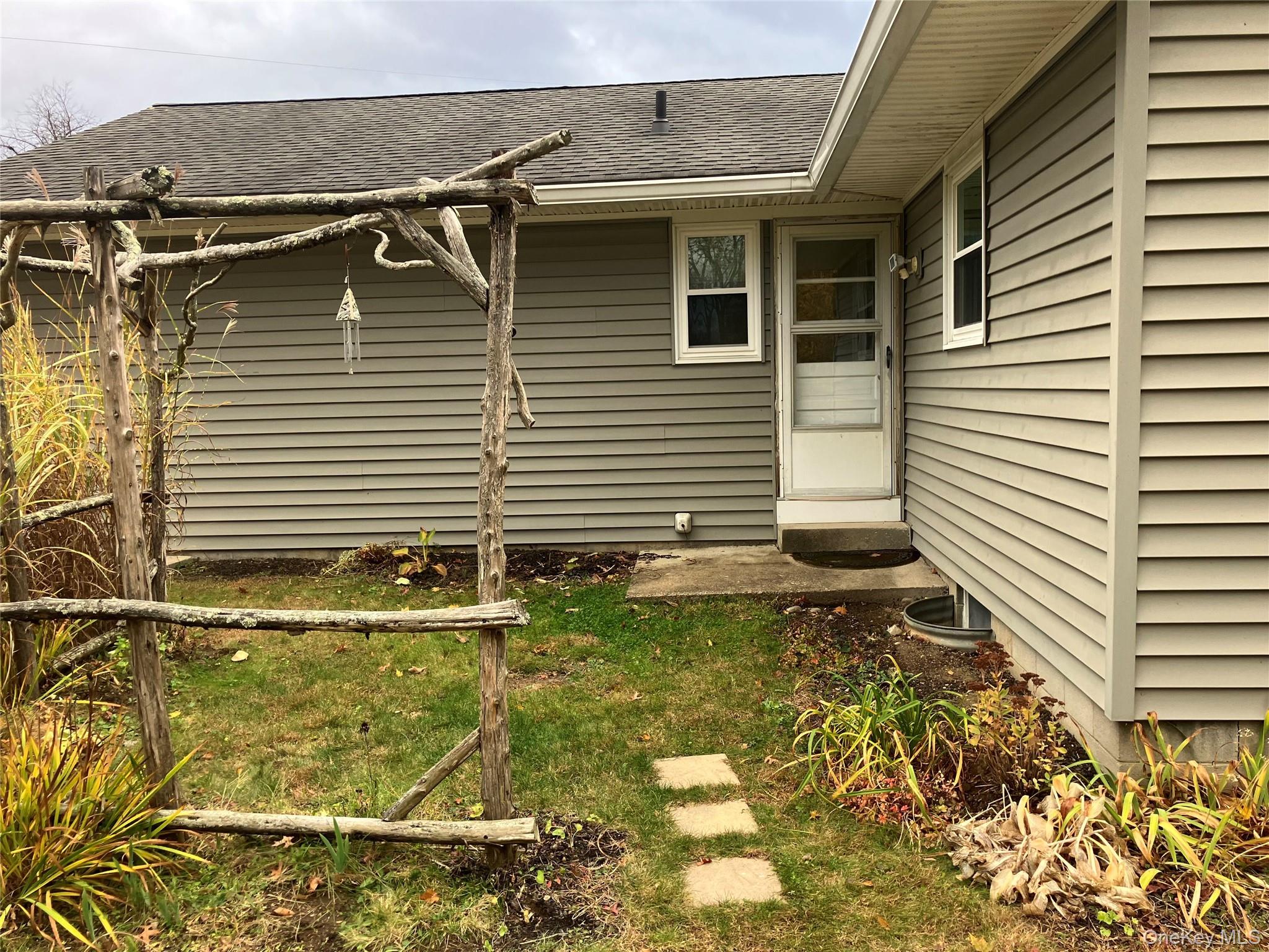 48 Jefferson Road Red Hook, NY 12571 - Photo 6 of 15 a view of a house with a yard and sitting area