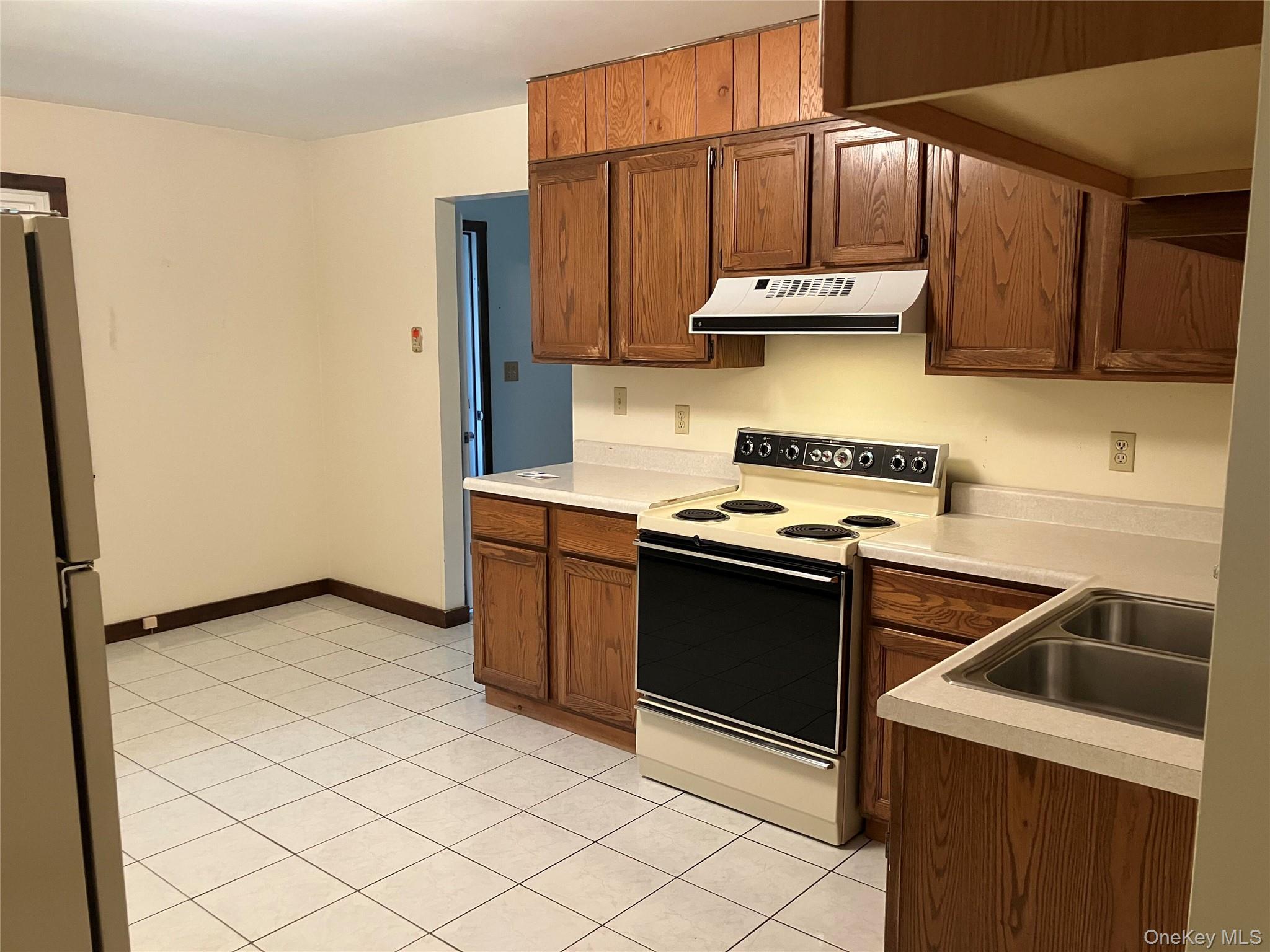 48 Jefferson Road Red Hook, NY 12571 - Photo 9 of 15 a kitchen with stainless steel appliances granite countertop a stove a sink and a refrigerator