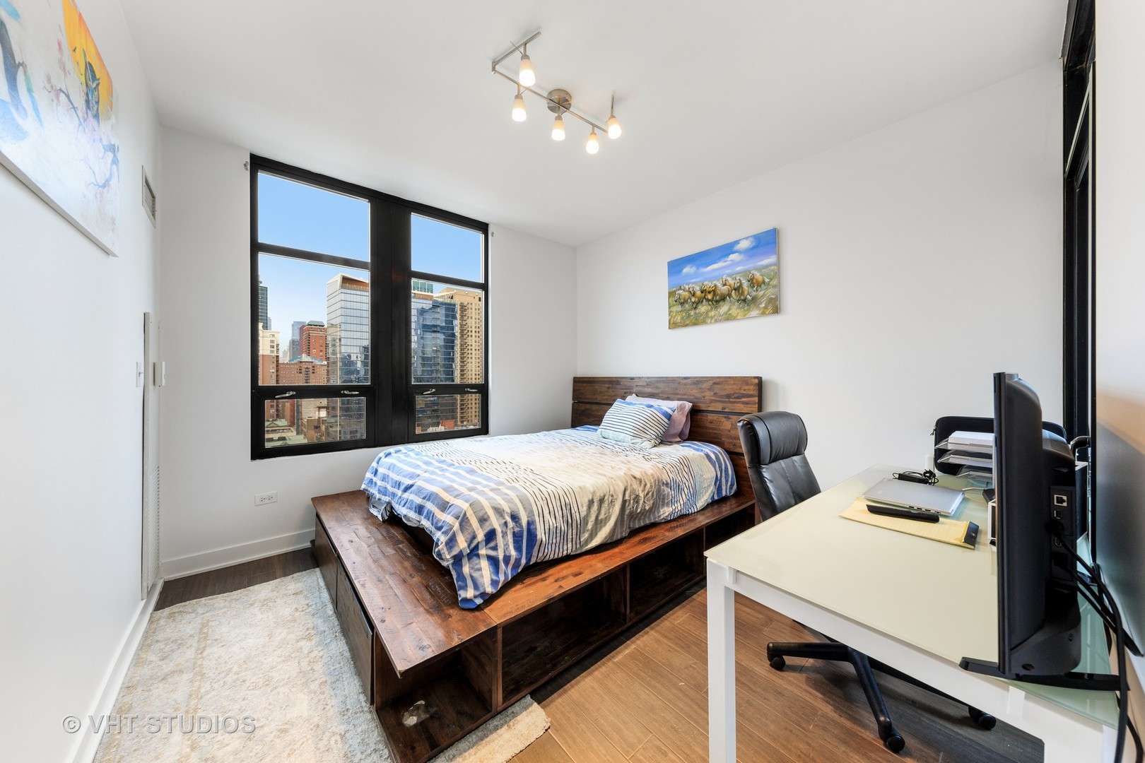 1255 South State Street, Unit 1603 Chicago, IL 60605 - Photo 17 of 21 a bedroom with two beds and a window
