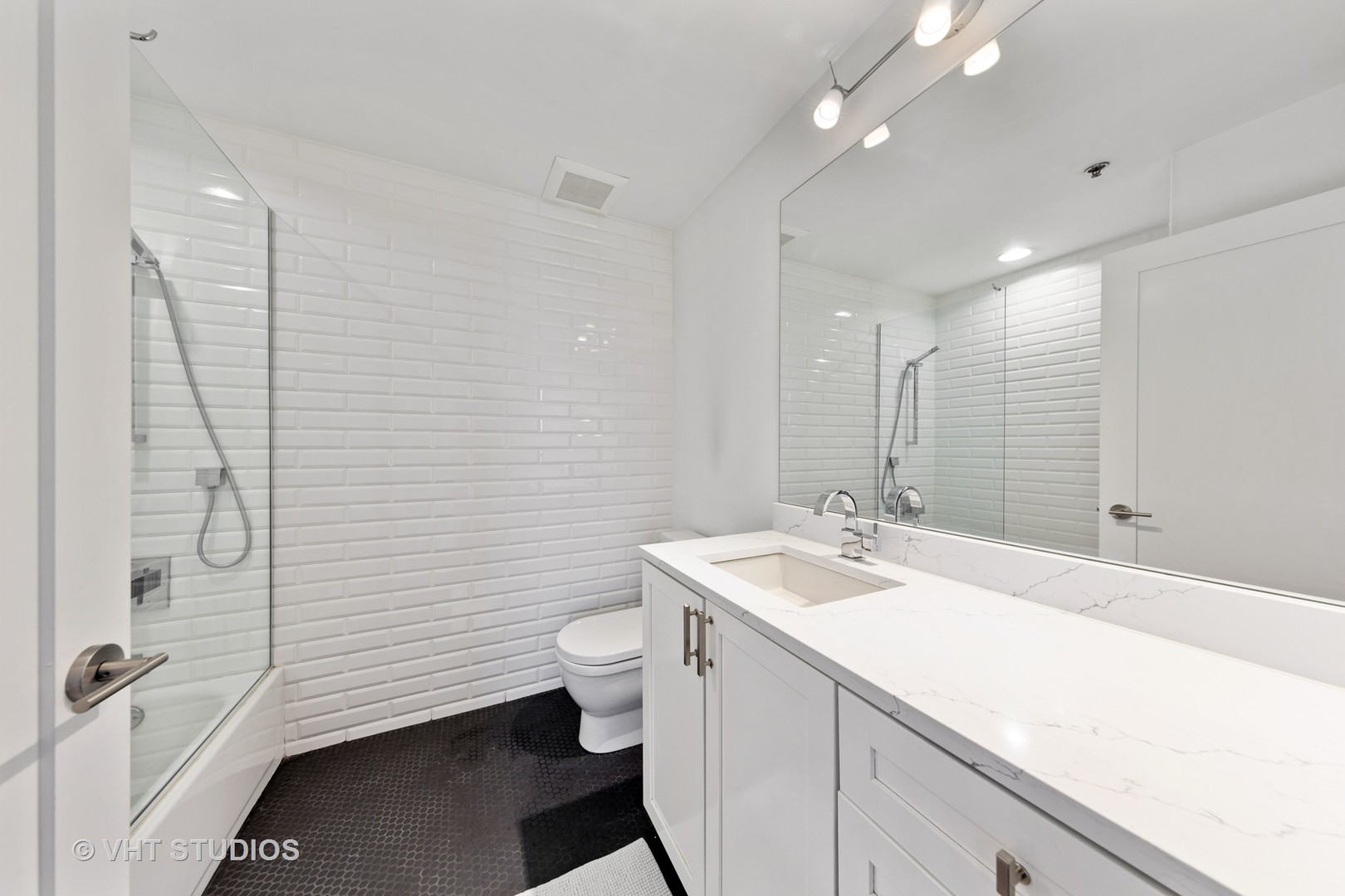1255 South State Street, Unit 1603 Chicago, IL 60605 - Photo 19 of 21 a bathroom with a sink a toilet and shower