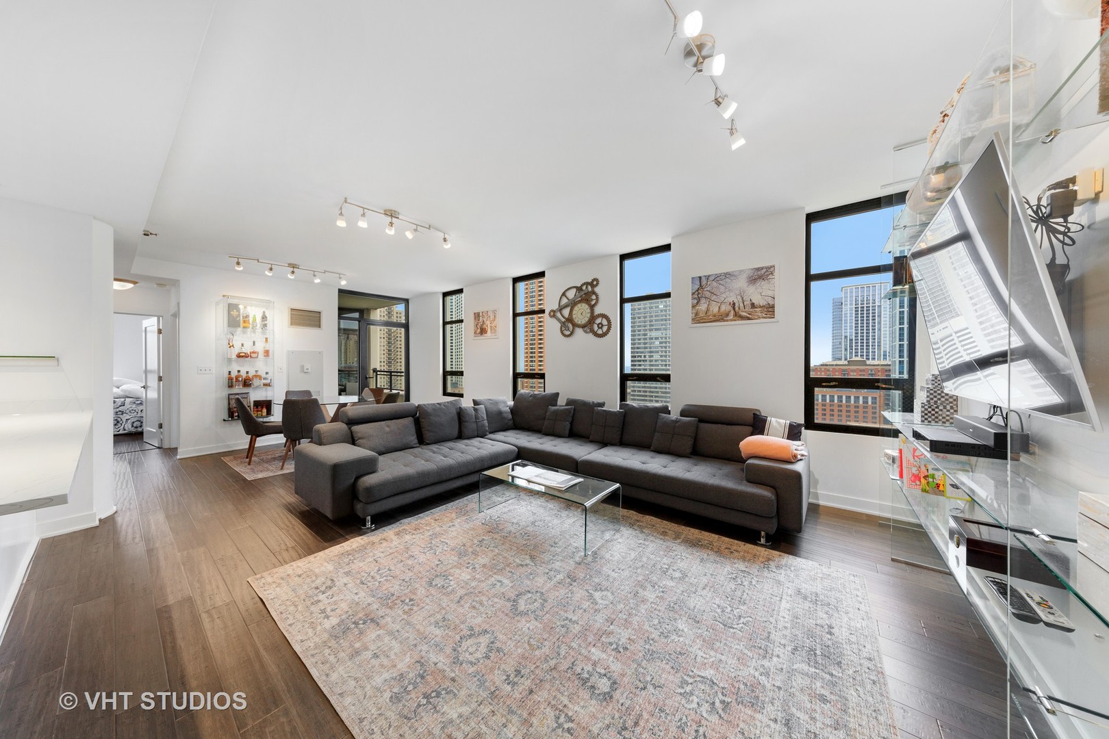 1255 South State Street, Unit 1603 Chicago, IL 60605 - Photo 4 of 21 a living room with furniture and a wooden floor