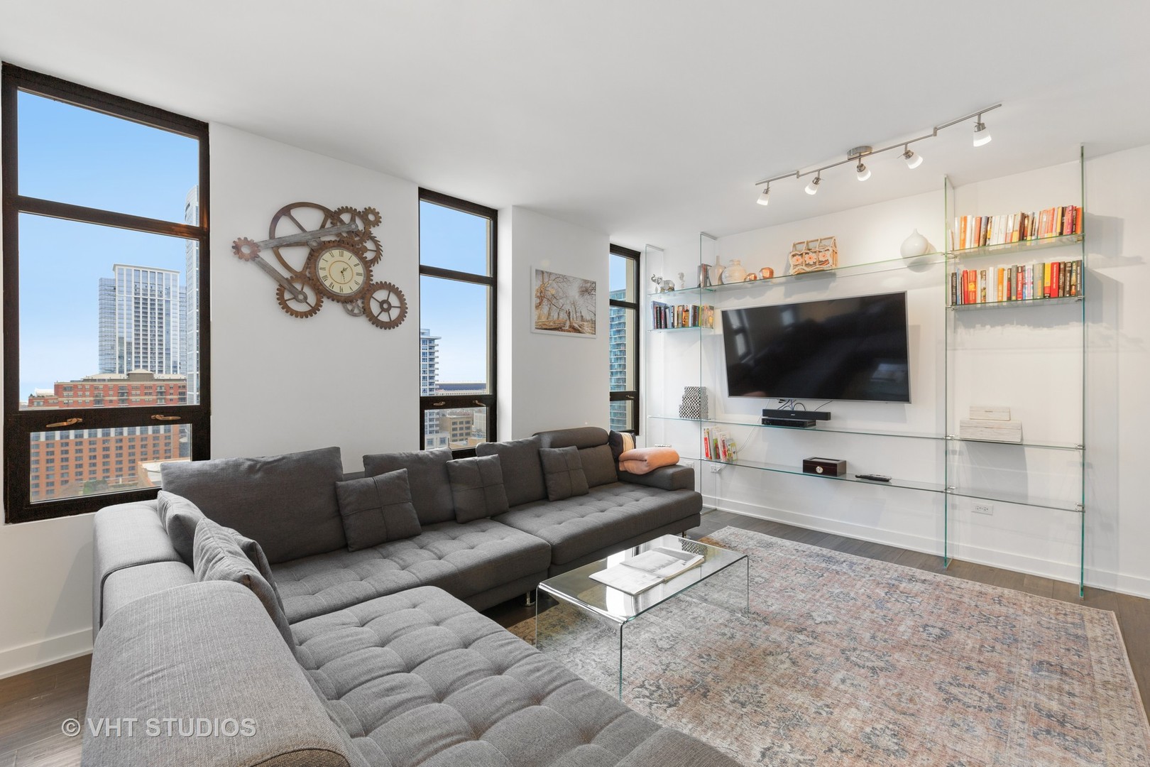 1255 South State Street, Unit 1603 Chicago, IL 60605 - Photo 6 of 21 a living room with furniture and a flat screen tv
