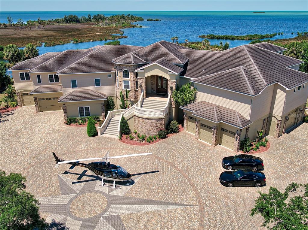 1227 Osowaw Boulevard Spring Hill, FL 34607 - Photo 2 of 96 an aerial view of a house with outdoor space and swimming pool