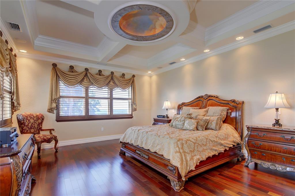1227 Osowaw Boulevard Spring Hill, FL 34607 - Photo 45 of 96 a bedroom with a bed and wooden floor