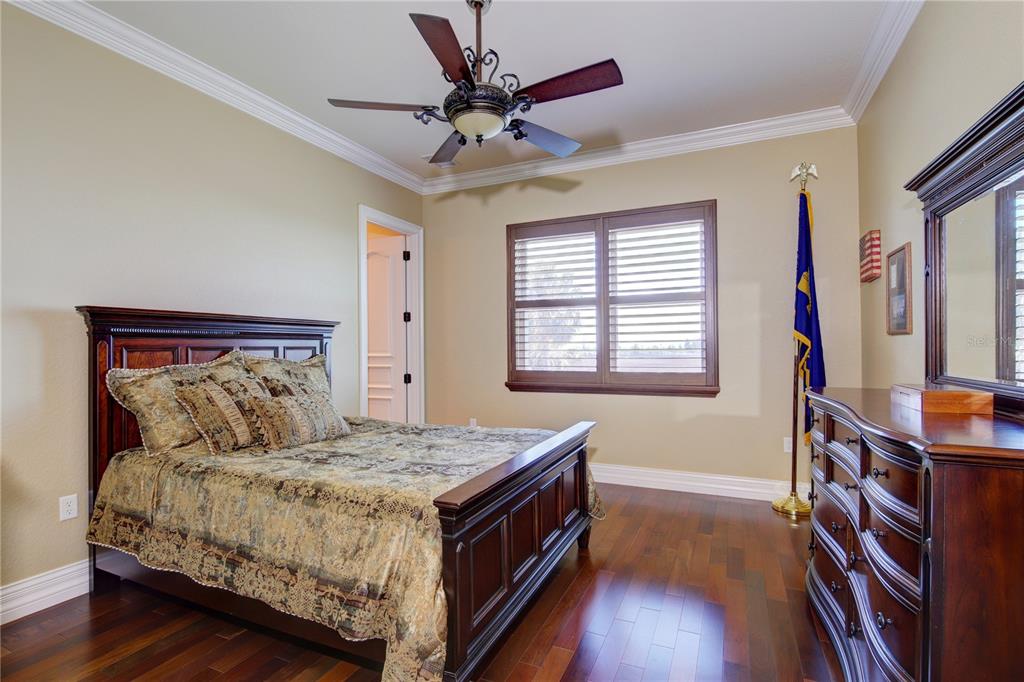 1227 Osowaw Boulevard Spring Hill, FL 34607 - Photo 59 of 96 a bed sitting in a bedroom next to a window