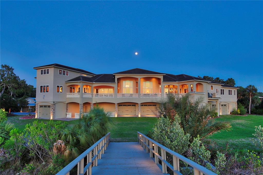 1227 Osowaw Boulevard Spring Hill, FL 34607 - Photo 6 of 96 a front view of a house with a yard