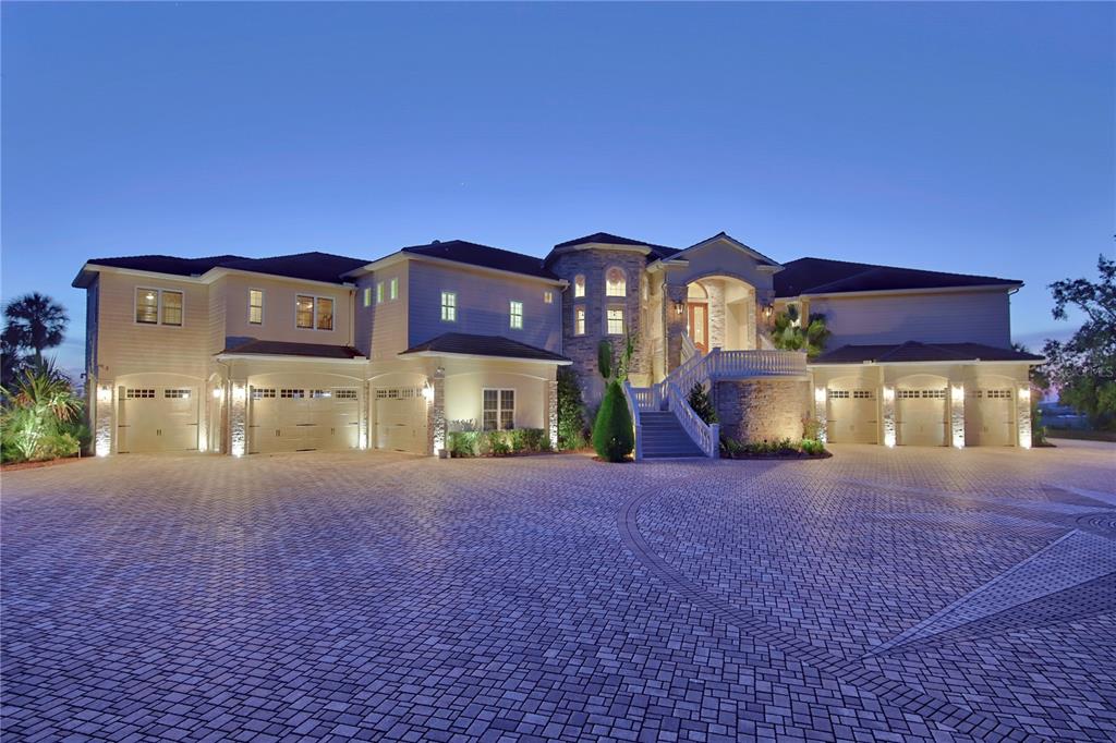 1227 Osowaw Boulevard Spring Hill, FL 34607 - Photo 8 of 96 a front view of a house with a yard and garage