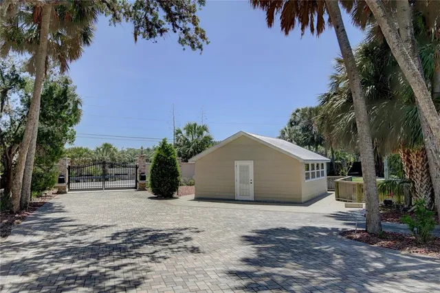 a living room with furniture a chandelier and a fireplace