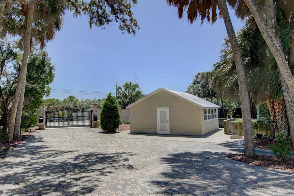 1227 Osowaw Boulevard Spring Hill, FL 34607 - Photo 10 of 96 a view of a house with a yard and potted plants