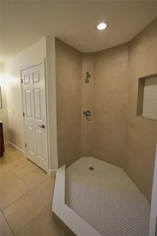 a bathroom with a bathtub and shower