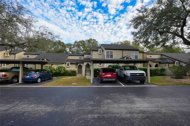 a view of a cars park in front of house
