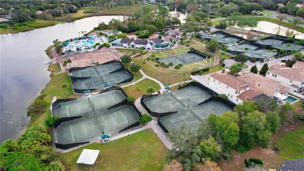 an aerial view of a house with yard swimming pool and outdoor seating