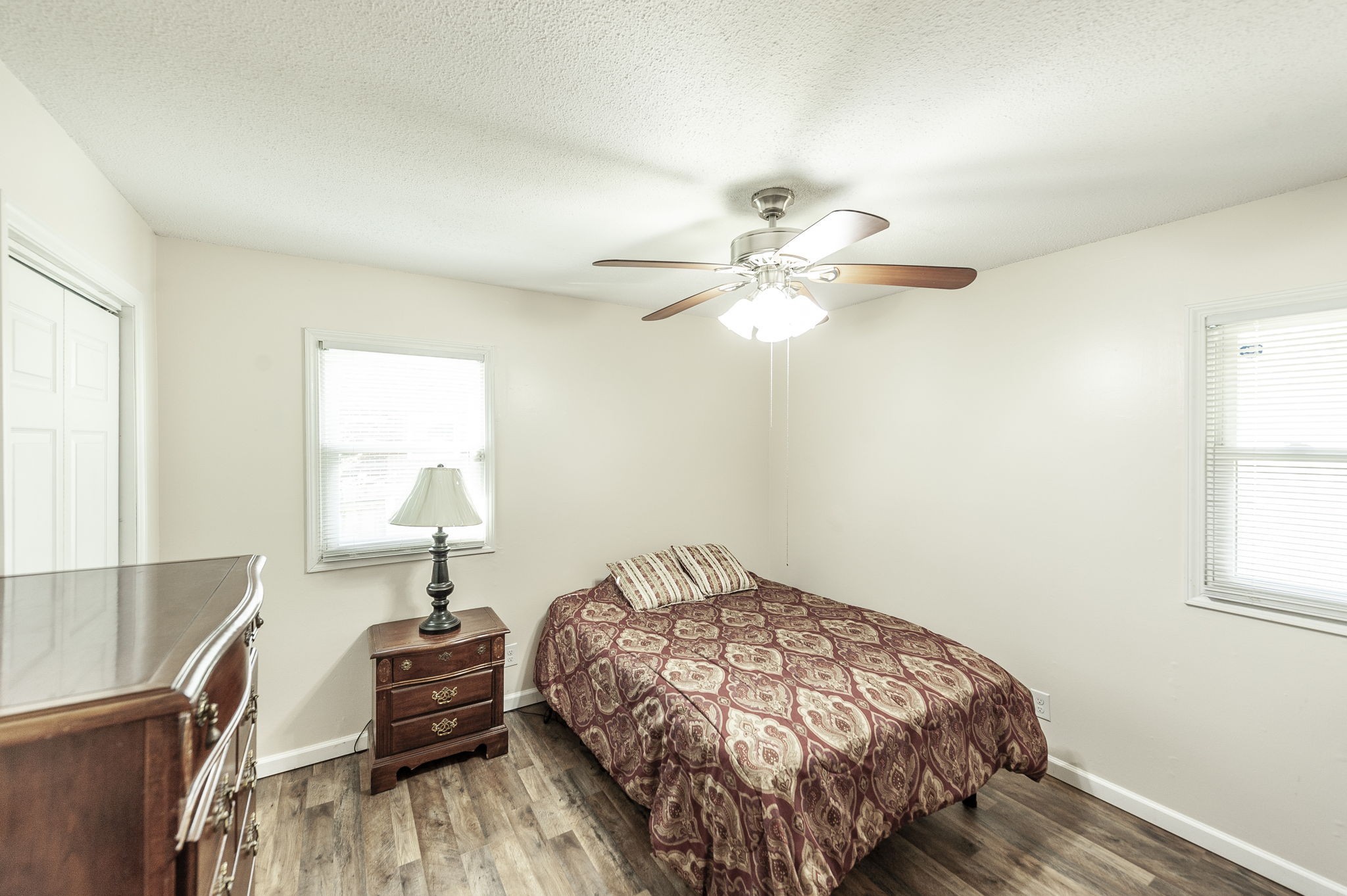 1711 Woodside Drive Springfield, TN 37172 - Photo 11 of 20 a bedroom with a bed and a chandelier