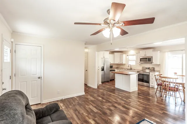 a view of kitchen and dining room with wooden floor