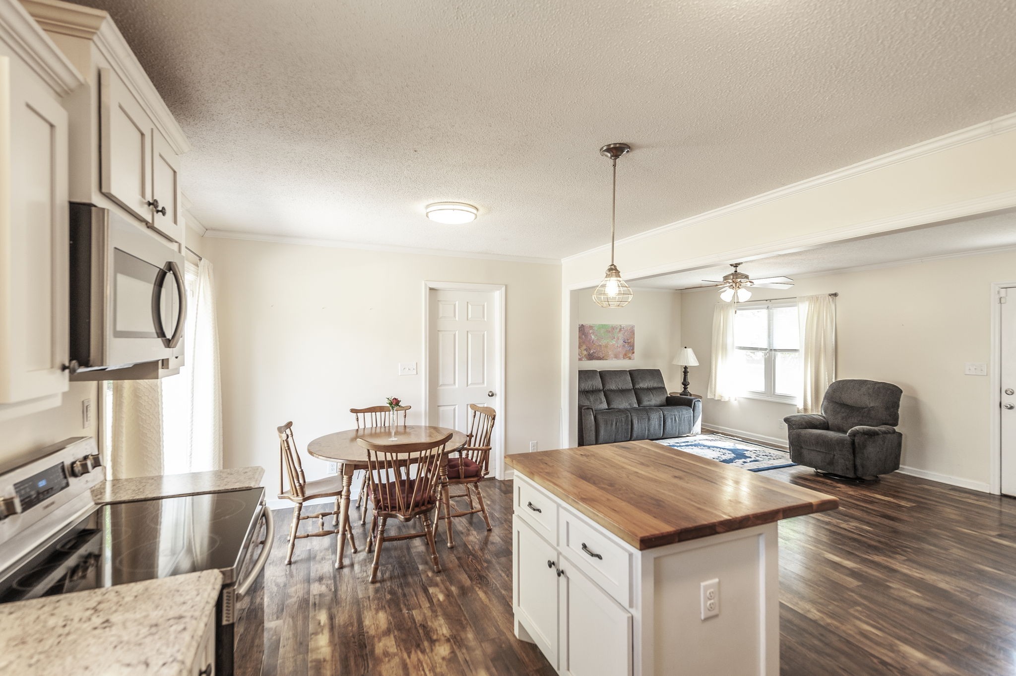 1711 Woodside Drive Springfield, TN 37172 - Photo 10 of 20 a kitchen with stainless steel appliances kitchen island granite countertop a table chairs and a refrigerator