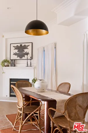 a dining room with a table and chairs