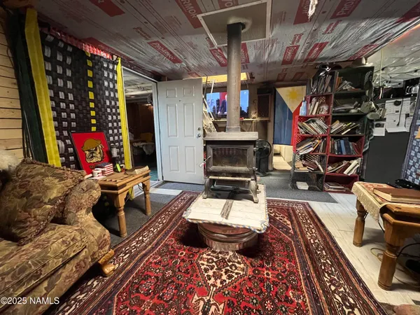 a living room with furniture a rug and a fireplace