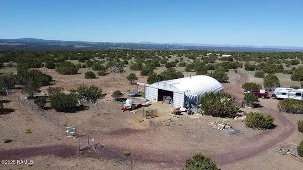 an aerial view of a house with a garden