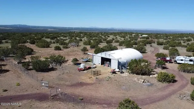 an aerial view of a house with a garden
