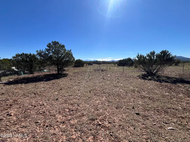 a view of a road with a building in the background