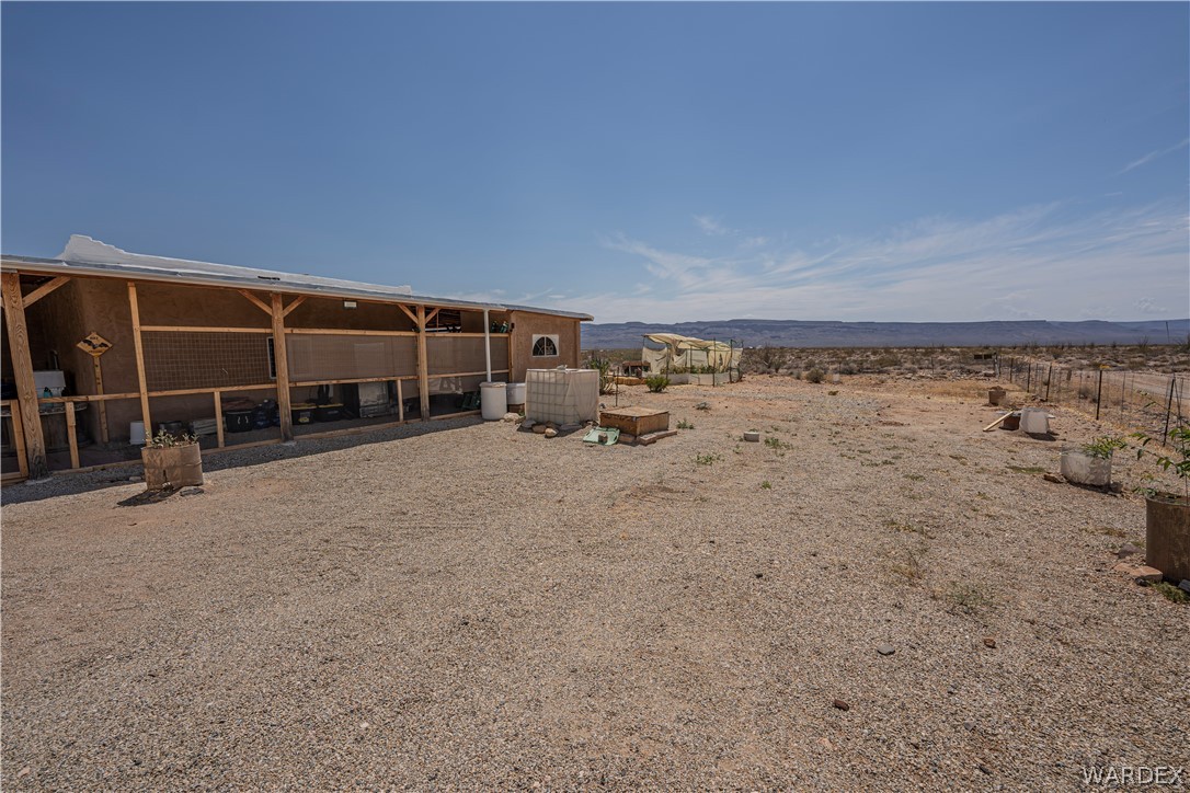 2620 Voss Road Yucca, AZ 86438 - Photo 30 of 40 a view of a house with a outdoor space