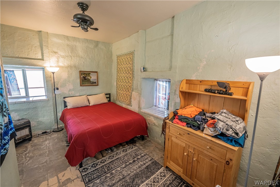 2620 Voss Road Yucca, AZ 86438 - Photo 5 of 40 a bedroom with bed and a window