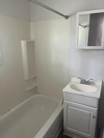 a bathroom with a sink and a bathtub