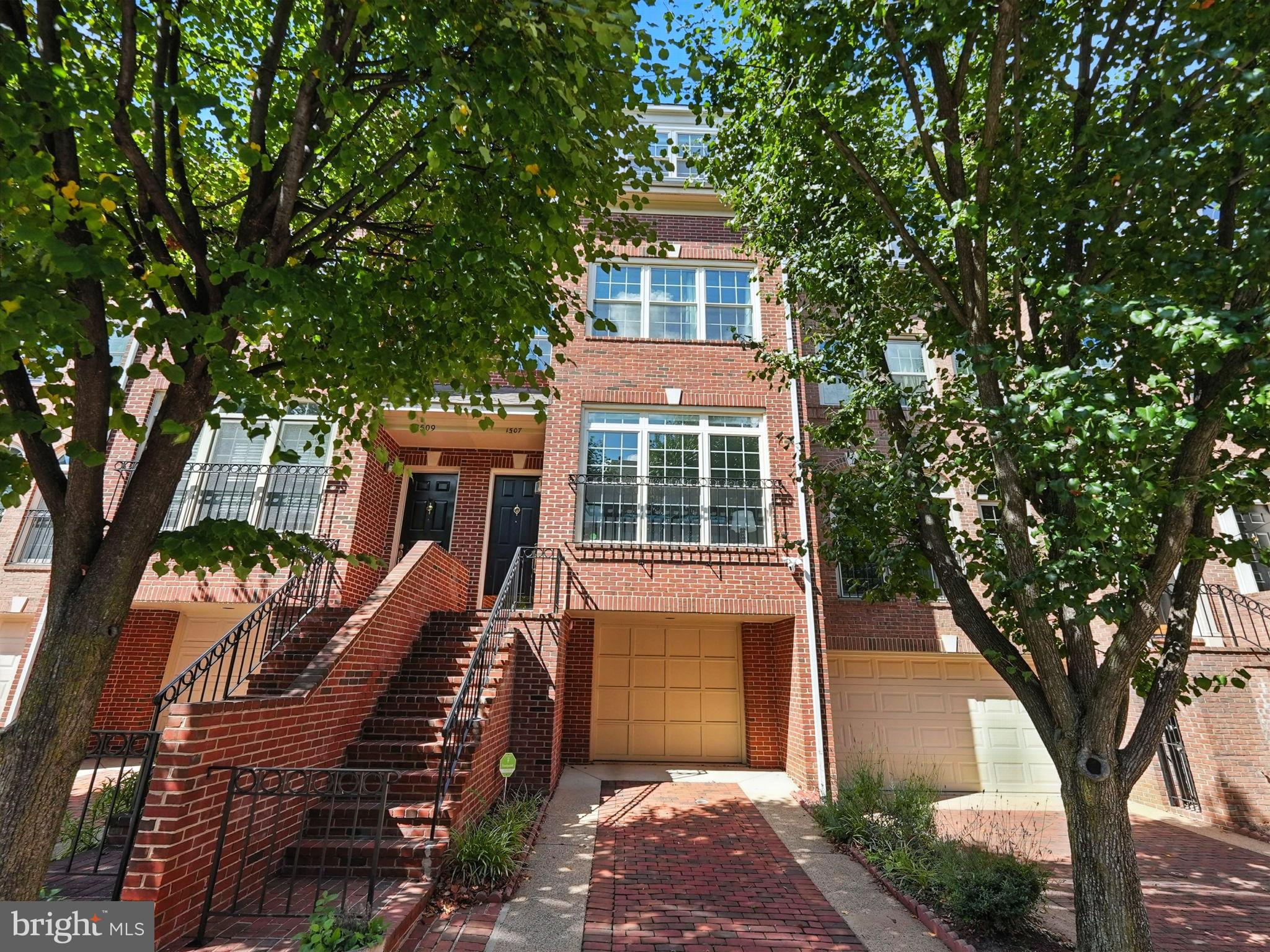 1507 North Colonial Court Arlington, VA 22209 - Photo 1 of 1 a front view of a house with a tree