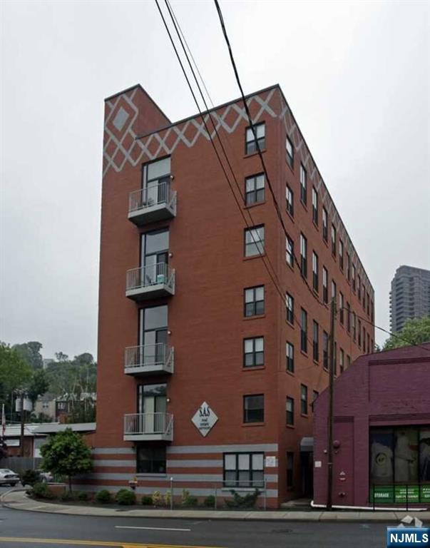 840 River Road, Unit 302 Edgewater, NJ 07020 - Photo 1 of 6 a front view of a building