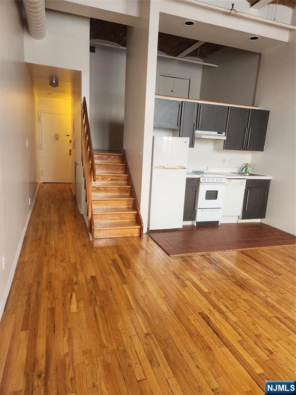 840 River Road, Unit 302 Edgewater, NJ 07020 - Photo 2 of 6 a view of a bedroom with wooden floor and closet