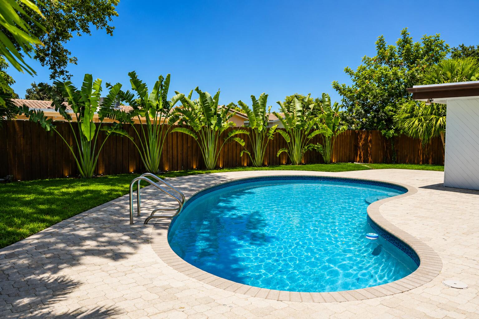 4815 Cleveland Street Hollywood, FL 33021 - Photo 30 of 31 a view of a swimming pool with a yard