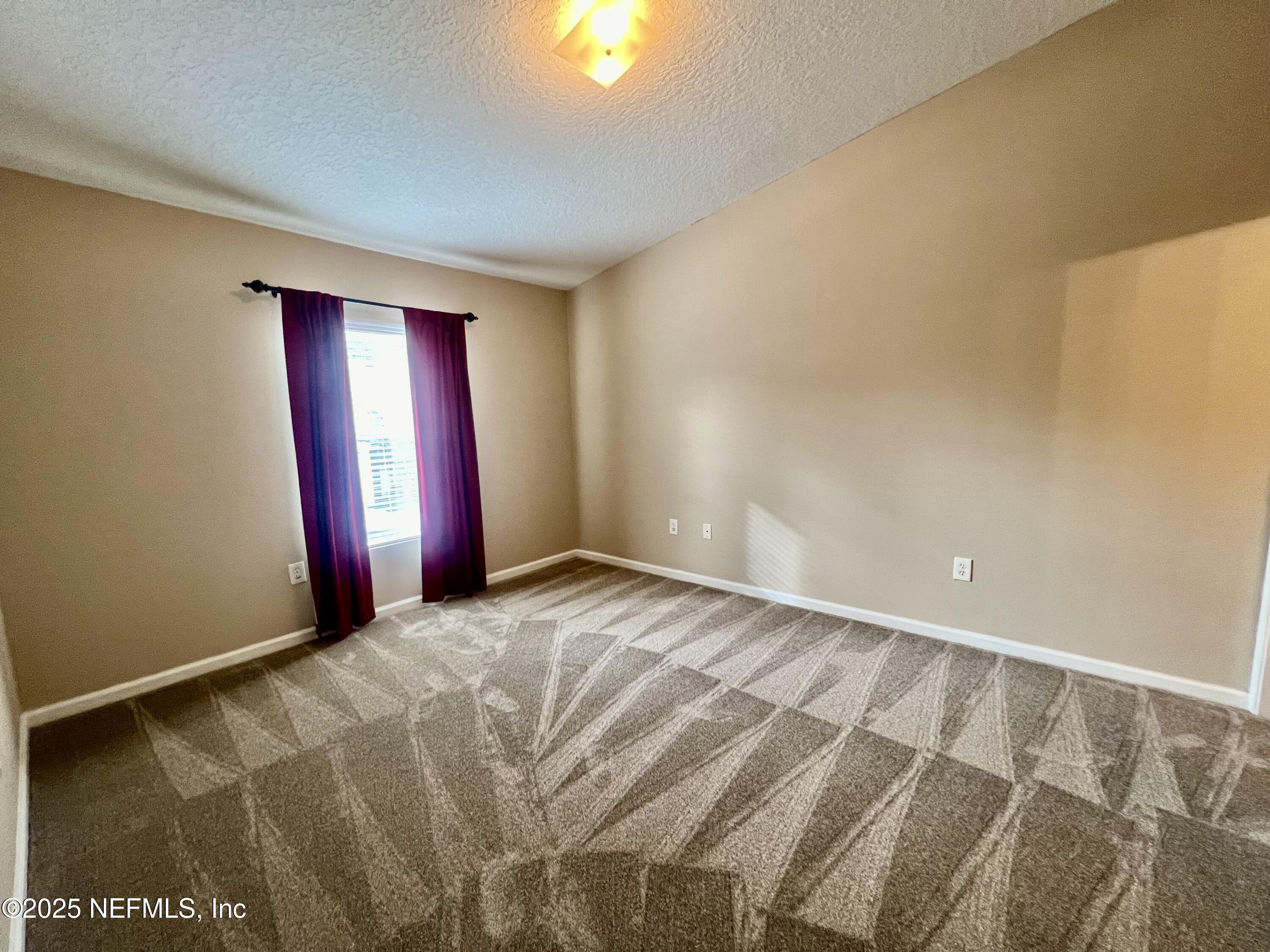 7920 Merrill Road, Unit 709 Jacksonville, FL 32277 - Photo 20 of 35 a view of an empty room