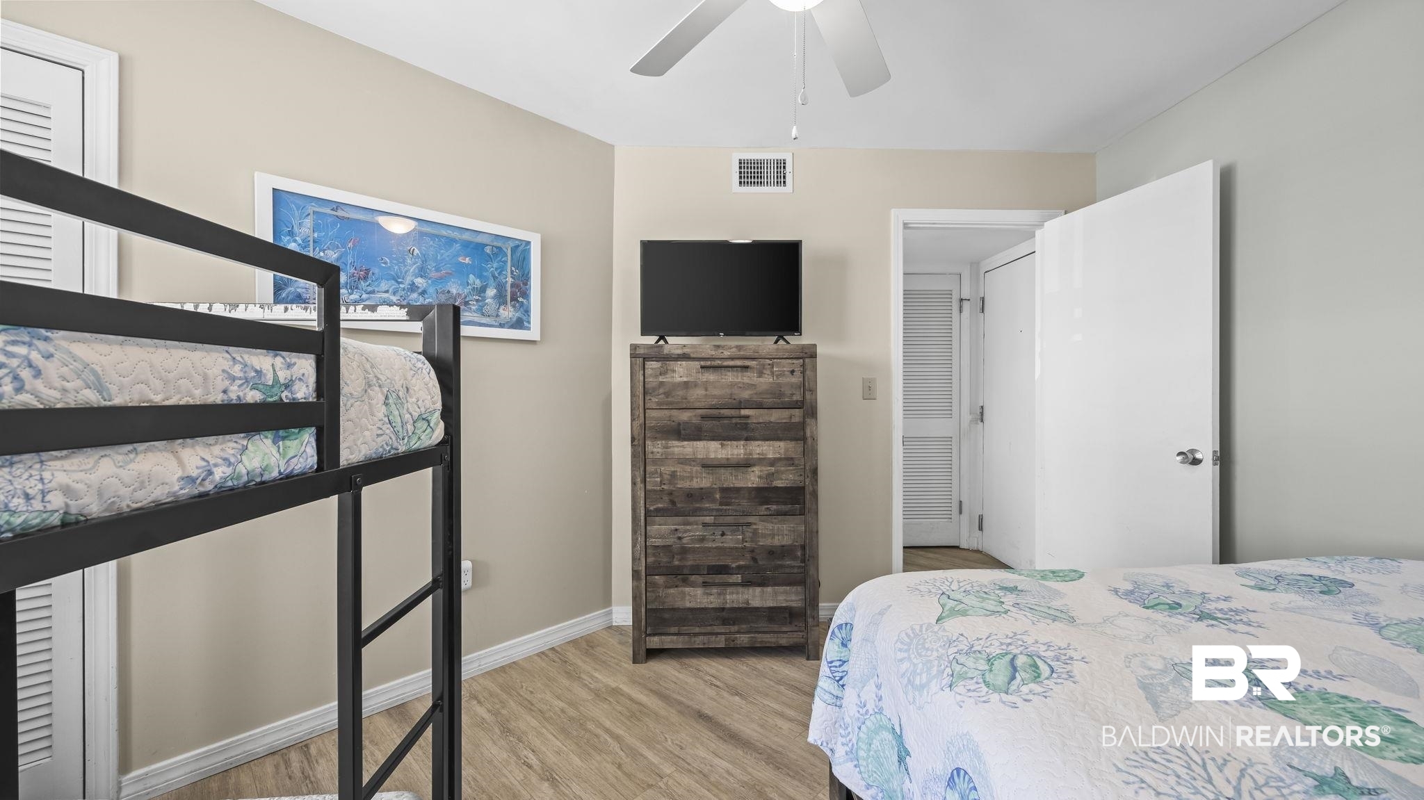 497 Plantation Road, Unit 1247 Gulf Shores, AL 36542 - Photo 15 of 29 Bedroom featuring light wood-type flooring and a ceiling fan
