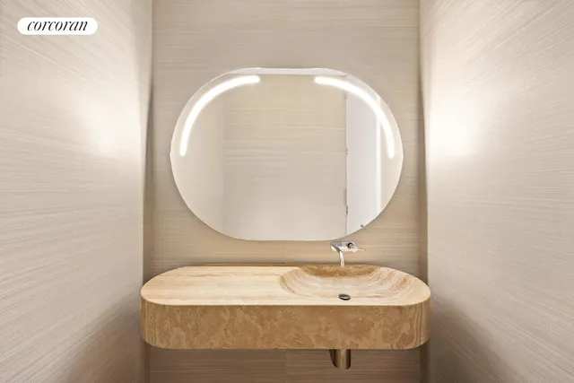 a bathroom with a sink and mirror