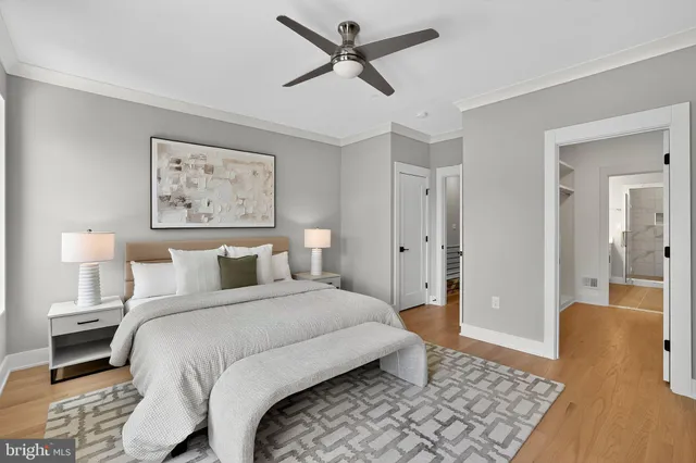 a view of walk in closet and wooden floor