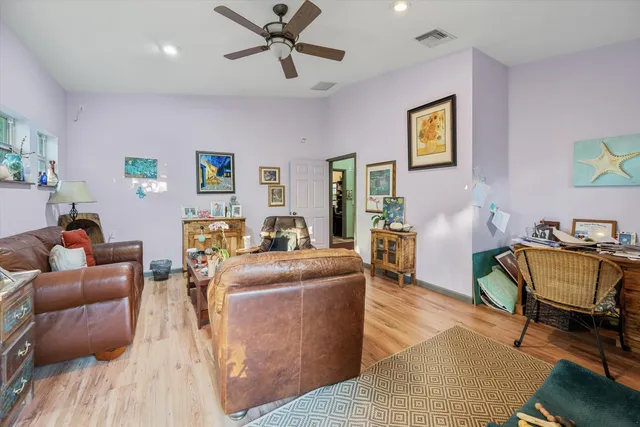a living room with furniture rug and window