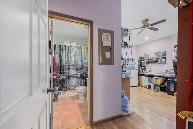 a view of a livingroom with furniture and a window